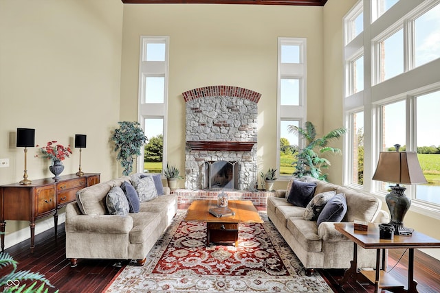 523 S 700 E, Whitestown, IN 46075 - living room featuring a towering ceiling, dark wood finished floors, and a fireplace