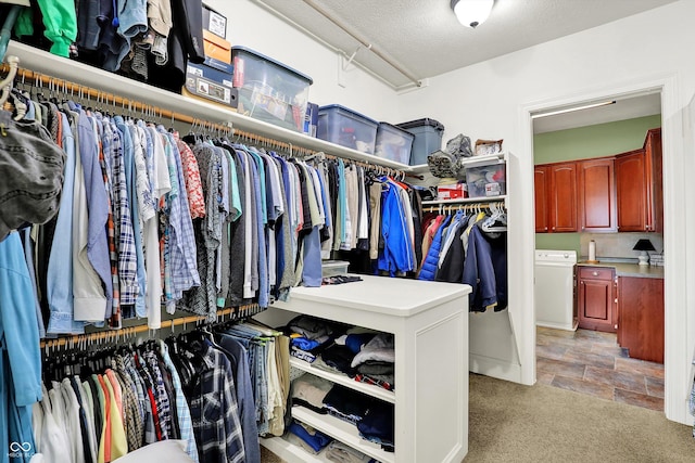 523 S 700 E, Whitestown, IN 46075 - spacious closet featuring light stone finish floors, washer / clothes dryer, and light colored carpet
