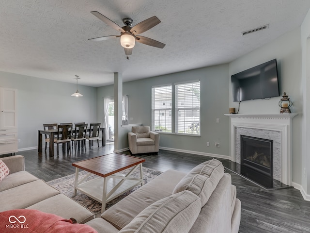 8330 Whitaker Valley Blvd, Indianapolis, IN 46237 - living room with ceiling fan, wood finished floors, a textured ceiling, and a high end fireplace