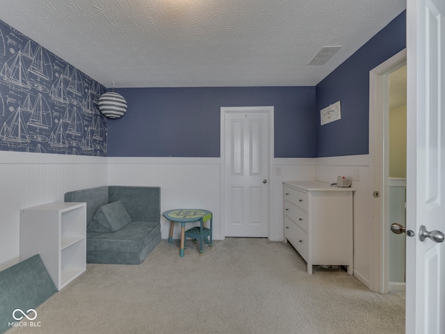 8330 Whitaker Valley Blvd, Indianapolis, IN 46237 - living area with a wainscoted wall, carpet flooring, and a textured ceiling