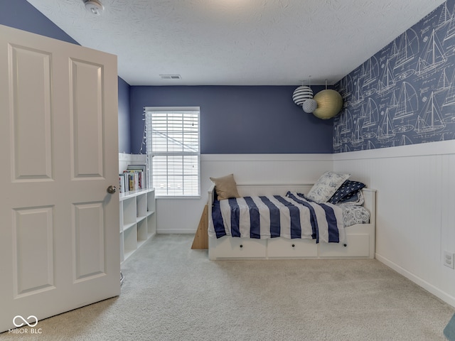 8330 Whitaker Valley Blvd, Indianapolis, IN 46237 - bedroom featuring wainscoting, a textured ceiling, and carpet