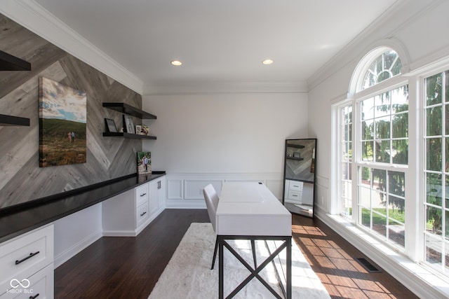 10334 Strongbow Rd, Fishers, IN 46040 - dining area with healthy amount of natural light, a desk, dark wood-style floors, crown molding, and wainscoting