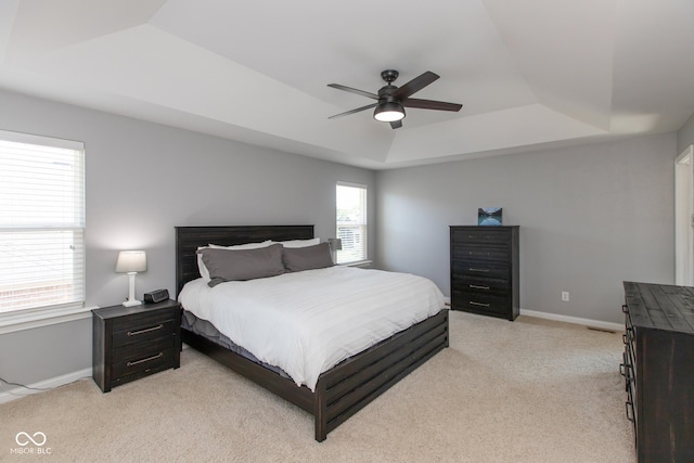 10334 Strongbow Rd, Fishers, IN 46040 - bedroom featuring a raised ceiling, light carpet, and ceiling fan