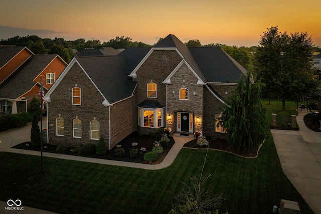 10334 Strongbow Rd, Fishers, IN 46040 - view of front of home with a front yard and brick siding