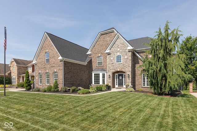 10334 Strongbow Rd, Fishers, IN 46040 - traditional-style home featuring brick siding and a front yard