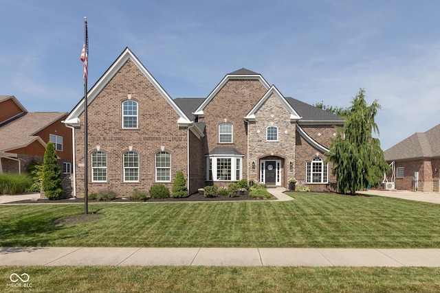 10334 Strongbow Rd, Fishers, IN 46040 - view of front of house with brick siding and a front lawn
