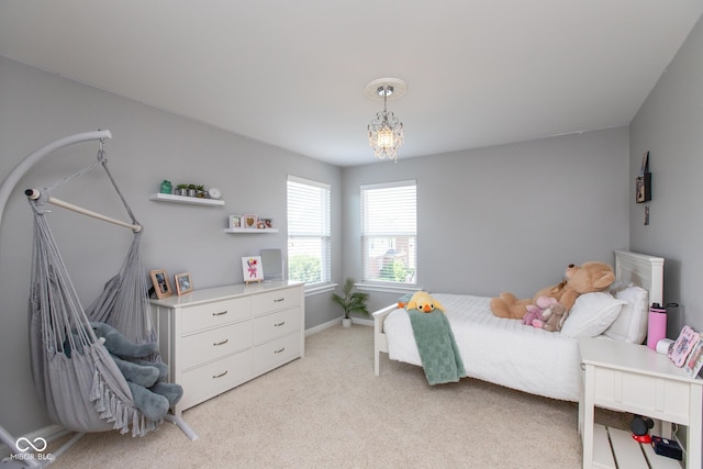 10334 Strongbow Rd, Fishers, IN 46040 - bedroom with light colored carpet and a chandelier