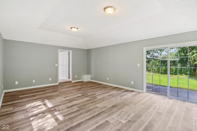 4113 Red Bird Dr, Indianapolis, IN 46222 - spare room with wood finished floors and lofted ceiling