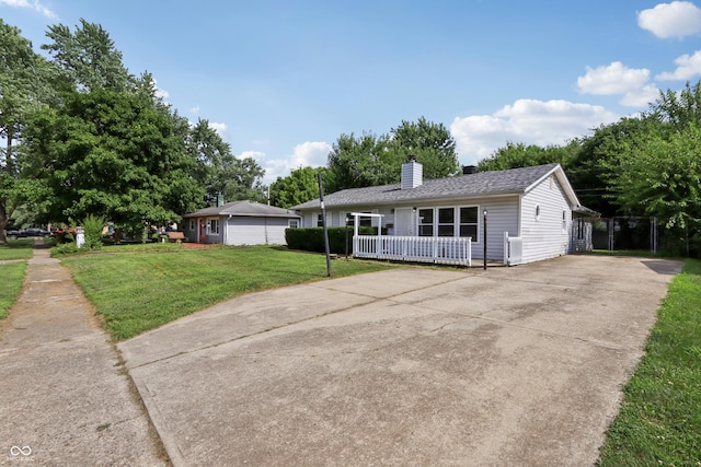 4113 Red Bird Dr, Indianapolis, IN 46222 - ranch-style home with concrete driveway, a chimney, and a front yard