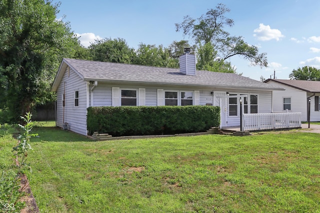 4113 Red Bird Dr, Indianapolis, IN 46222 - view of front of property with a chimney, a front lawn, and a shingled roof
