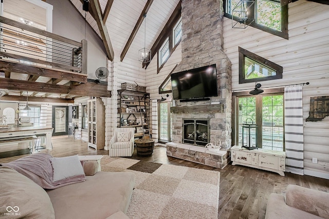10823 E 200 N, Sheridan, IN 46069 - living room featuring high vaulted ceiling, wood-type flooring, a fireplace, and a wood ceiling with exposed beams