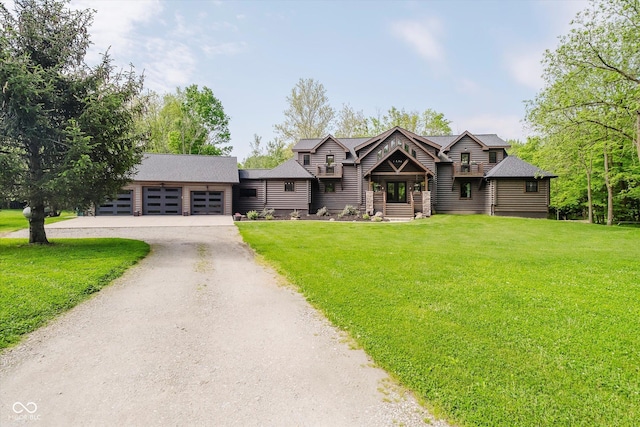 10823 E 200 N, Sheridan, IN 46069 - view of front of house featuring an attached garage, driveway, a front yard, and roof with shingles