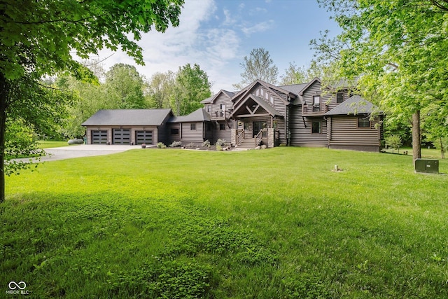 10823 E 200 N, Sheridan, IN 46069 - back of house featuring driveway, a lawn, and a garage