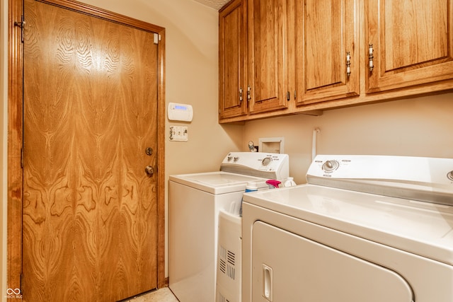 5123 Marble Ct, Indianapolis, IN 46237 - washroom with washer and dryer, cabinet space, and tile patterned flooring