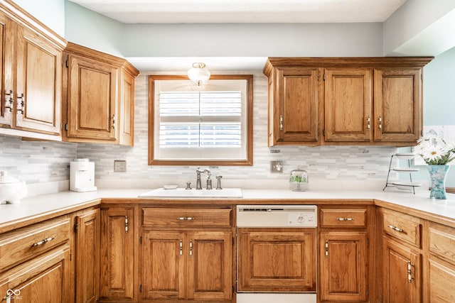 5123 Marble Ct, Indianapolis, IN 46237 - kitchen featuring dishwashing machine, tasteful backsplash, light countertops, and brown cabinets