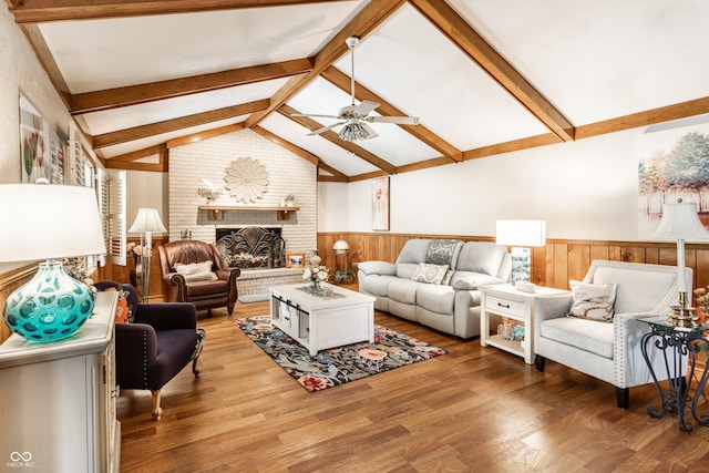 5123 Marble Ct, Indianapolis, IN 46237 - living area with a ceiling fan, a wainscoted wall, wood finished floors, and a brick fireplace