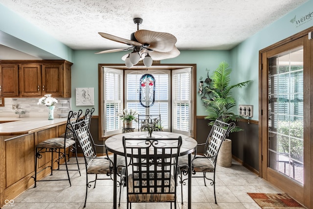5123 Marble Ct, Indianapolis, IN 46237 - dining room with healthy amount of natural light, ceiling fan, a textured ceiling, and light tile patterned flooring