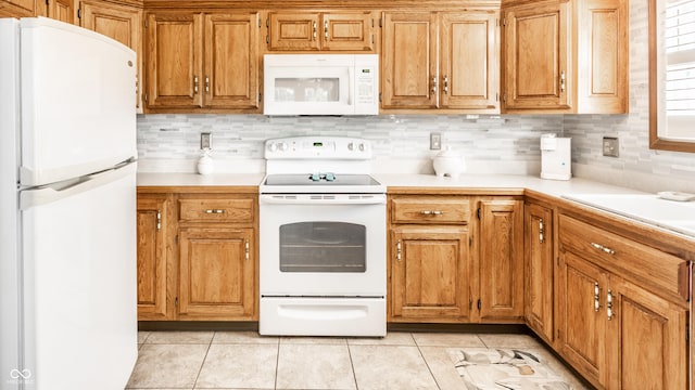 5123 Marble Ct, Indianapolis, IN 46237 - kitchen featuring white appliances, light countertops, decorative backsplash, and light tile patterned floors