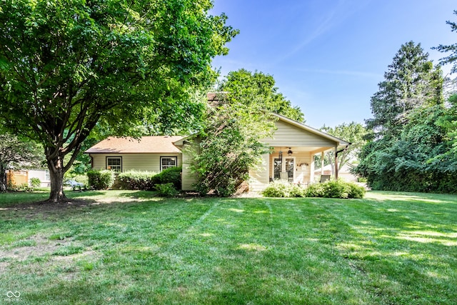 5123 Marble Ct, Indianapolis, IN 46237 - view of front of property with ceiling fan, a front yard, and a chimney