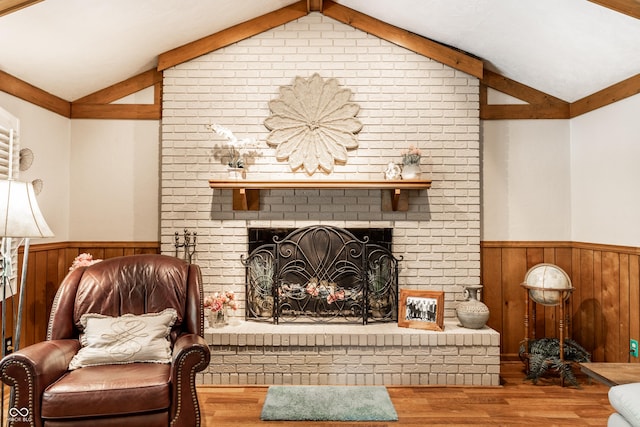 5123 Marble Ct, Indianapolis, IN 46237 - living area with wainscoting, wood finished floors, wooden walls, and a fireplace