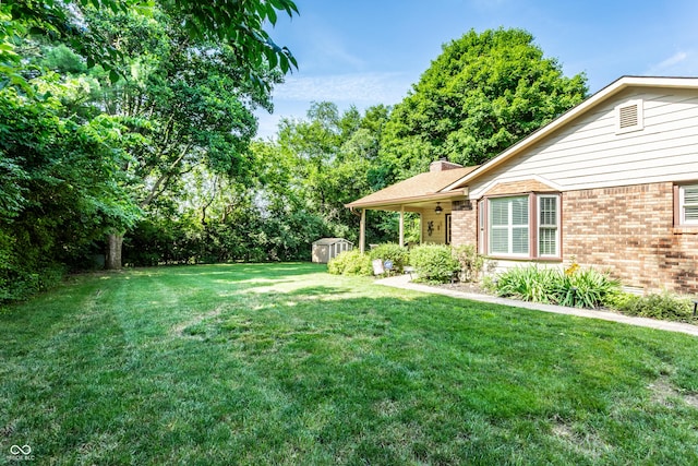 5123 Marble Ct, Indianapolis, IN 46237 - view of grassy yard featuring a shed