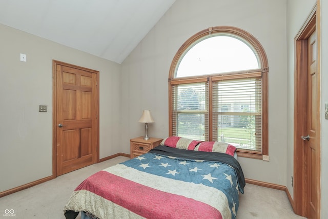 3696 Lakeshore Ct, Greenwood, IN 46143 - bedroom with light carpet, multiple windows, and vaulted ceiling