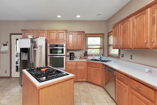3696 Lakeshore Ct, Greenwood, IN 46143 - kitchen featuring appliances with stainless steel finishes, light tile patterned flooring, light countertops, recessed lighting, and a kitchen island