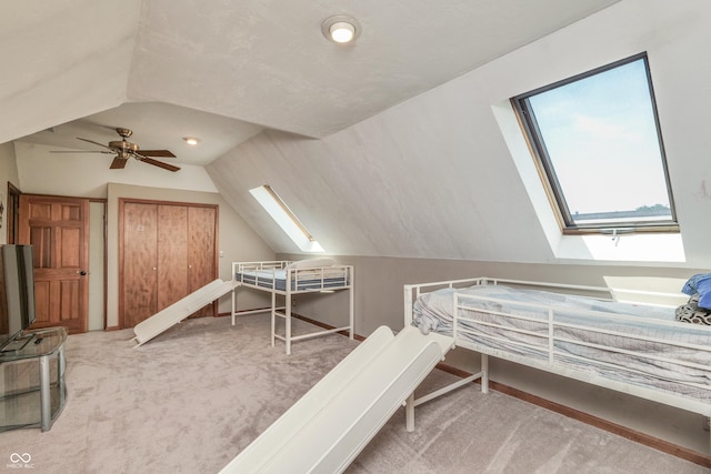 3696 Lakeshore Ct, Greenwood, IN 46143 - bedroom featuring a skylight, vaulted ceiling, carpet flooring, and ceiling fan