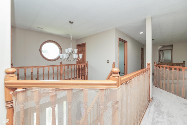 3696 Lakeshore Ct, Greenwood, IN 46143 - hallway featuring an upstairs landing, a chandelier, carpet flooring, and recessed lighting
