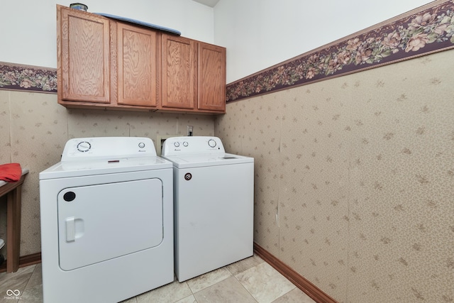 3696 Lakeshore Ct, Greenwood, IN 46143 - washroom with cabinet space, washing machine and dryer, and light tile patterned flooring