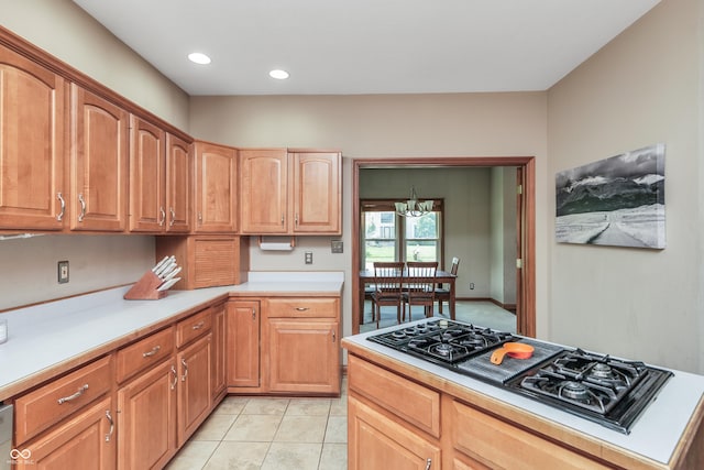 3696 Lakeshore Ct, Greenwood, IN 46143 - kitchen featuring black gas cooktop, light countertops, a chandelier, recessed lighting, and light tile patterned flooring