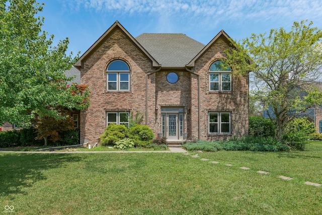3696 Lakeshore Ct, Greenwood, IN 46143 - traditional home featuring brick siding, a front lawn, and a shingled roof