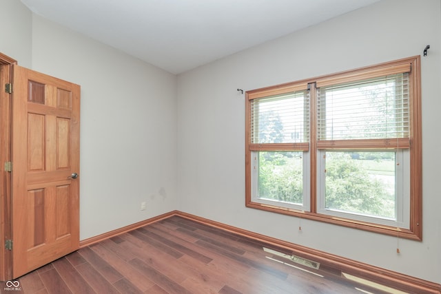 3696 Lakeshore Ct, Greenwood, IN 46143 - spare room with dark wood-style floors and baseboards