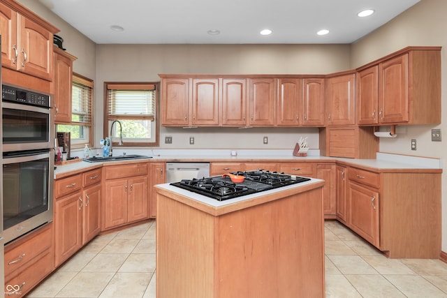 3696 Lakeshore Ct, Greenwood, IN 46143 - kitchen with double oven, black gas cooktop, light tile patterned flooring, light countertops, and a center island