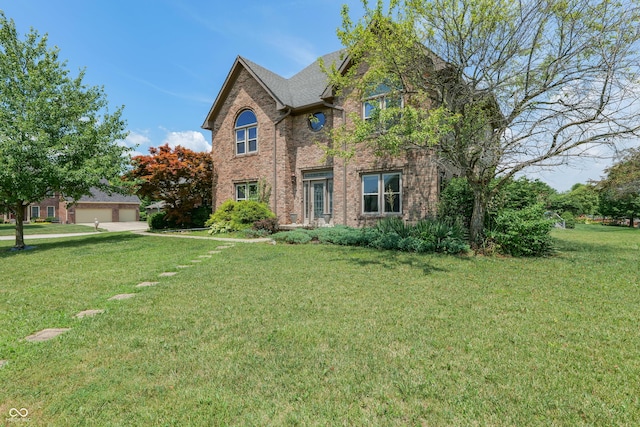 3696 Lakeshore Ct, Greenwood, IN 46143 - traditional-style home featuring brick siding, a front yard, and a garage