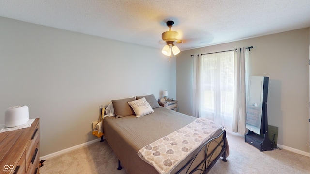 1623 Beech Cir, Plainfield, IN 46168 - bedroom with light colored carpet, a textured ceiling, and a ceiling fan