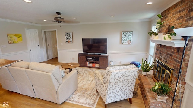 1623 Beech Cir, Plainfield, IN 46168 - living room featuring crown molding, a ceiling fan, recessed lighting, a fireplace, and a wainscoted wall