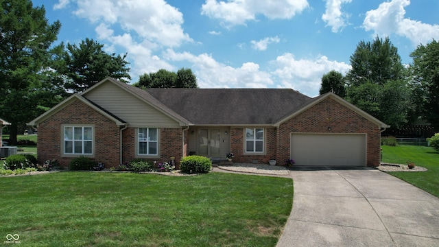1623 Beech Cir, Plainfield, IN 46168 - view of front of property with brick siding, a garage, driveway, and a front lawn