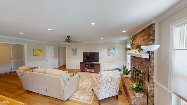 1623 Beech Cir, Plainfield, IN 46168 - living area featuring ceiling fan, a brick fireplace, wainscoting, ornamental molding, and recessed lighting