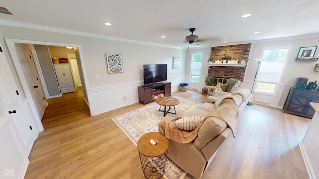 1623 Beech Cir, Plainfield, IN 46168 - living area featuring ceiling fan, light wood-style floors, crown molding, a brick fireplace, and recessed lighting