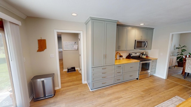 1623 Beech Cir, Plainfield, IN 46168 - kitchen with appliances with stainless steel finishes, gray cabinetry, light wood-type flooring, recessed lighting, and backsplash