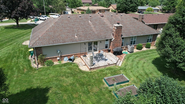 1623 Beech Cir, Plainfield, IN 46168 - rear view of house featuring a chimney, a yard, a garden, and brick siding