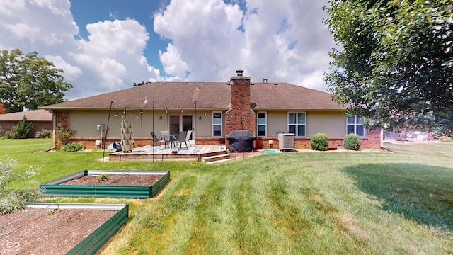 1623 Beech Cir, Plainfield, IN 46168 - back of property featuring a garden, brick siding, a chimney, a yard, and stucco siding