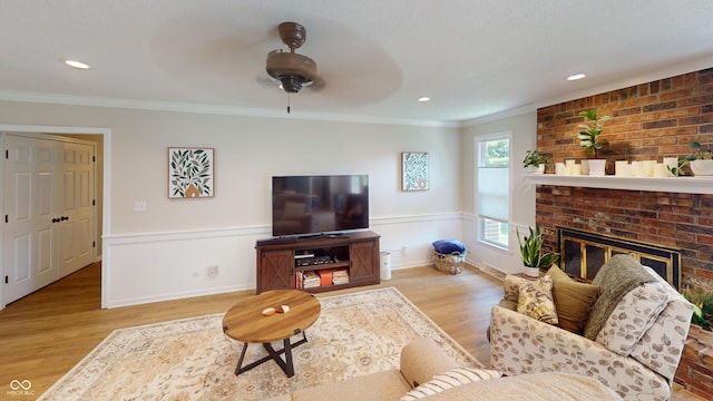 1623 Beech Cir, Plainfield, IN 46168 - living area with crown molding, wood finished floors, wainscoting, a ceiling fan, and a fireplace