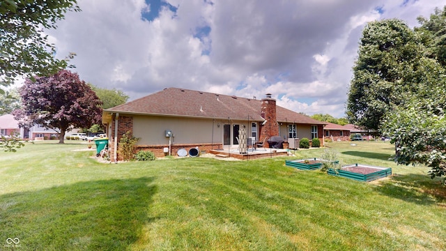 1623 Beech Cir, Plainfield, IN 46168 - rear view of property with a patio area, a lawn, brick siding, and a chimney