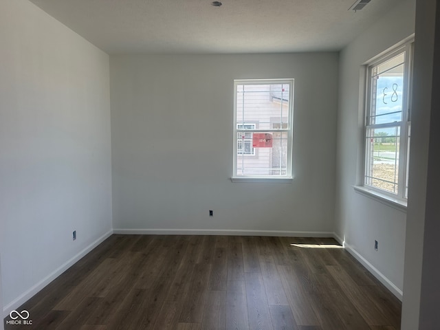 7893 Magnolia St, New Palestine, IN 46163 - unfurnished room with dark wood-style flooring and baseboards
