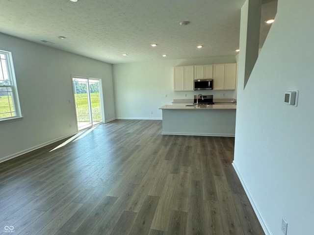 7893 Magnolia St, New Palestine, IN 46163 - unfurnished living room with dark wood finished floors and recessed lighting