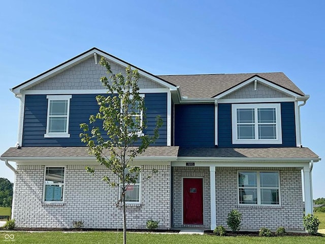 7893 Magnolia St, New Palestine, IN 46163 - craftsman inspired home with a front yard, covered porch, and brick siding