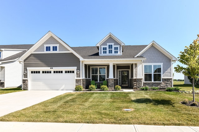 1360 Petit Verdot Dr, Westfield, IN 46074 - craftsman-style house with stone siding, a front lawn, driveway, and a shingled roof