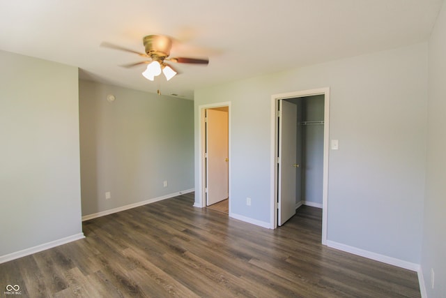 10610 Pavilion Dr, Indianapolis, IN 46259 - unfurnished bedroom with dark wood-style flooring, a spacious closet, and ceiling fan